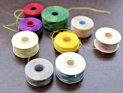 9 Bobbin Spools of Nylon Beading Jewelry Thread Various Colors