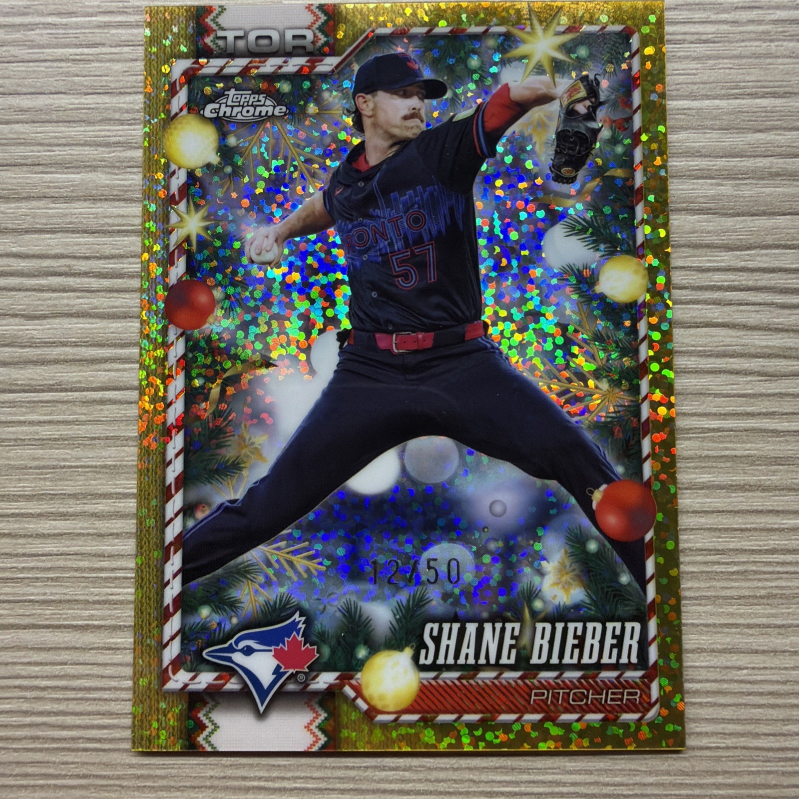 2026 Topps Holiday Chrome Metallic Gold Glitter Shane Bieber #12/50 Blue Jays