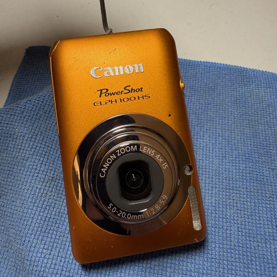 Cámara digital Canon PowerShot ELPH 100 HS 12 MP 4X zoom óptico naranja probado Foto 3 de 4