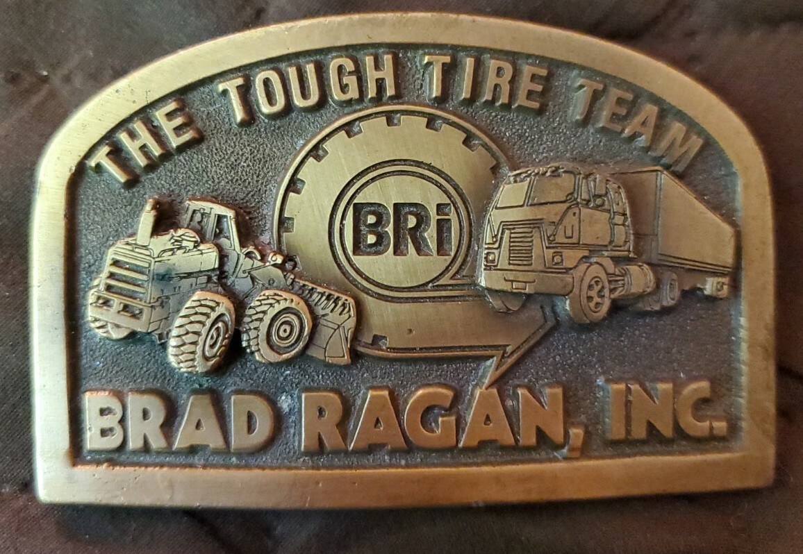 Vintage Brad Ragan Inc The Tough Tire Team Solid Bras… - Gem