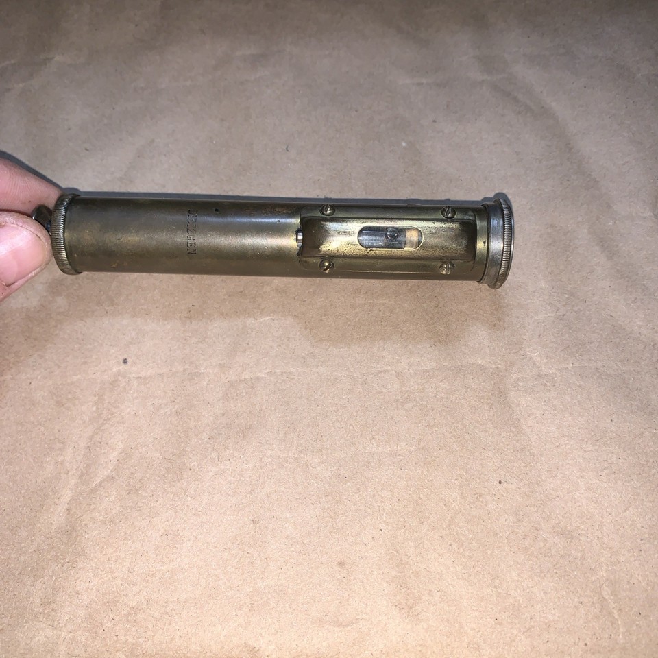 A solid brass pocket level by Dietzgen — a precision drafting and surveying instrument brand, this is a beautifully machined vintage brass object that looks stunning on a desk.