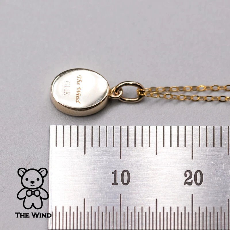 Collar colgante minimalista de ópalo doblete australiano con forma ovalada de oro amarillo de 14K Foto 4 de 4