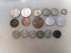 two silver ben franklin half dollars and a silver quarter and some other stuff