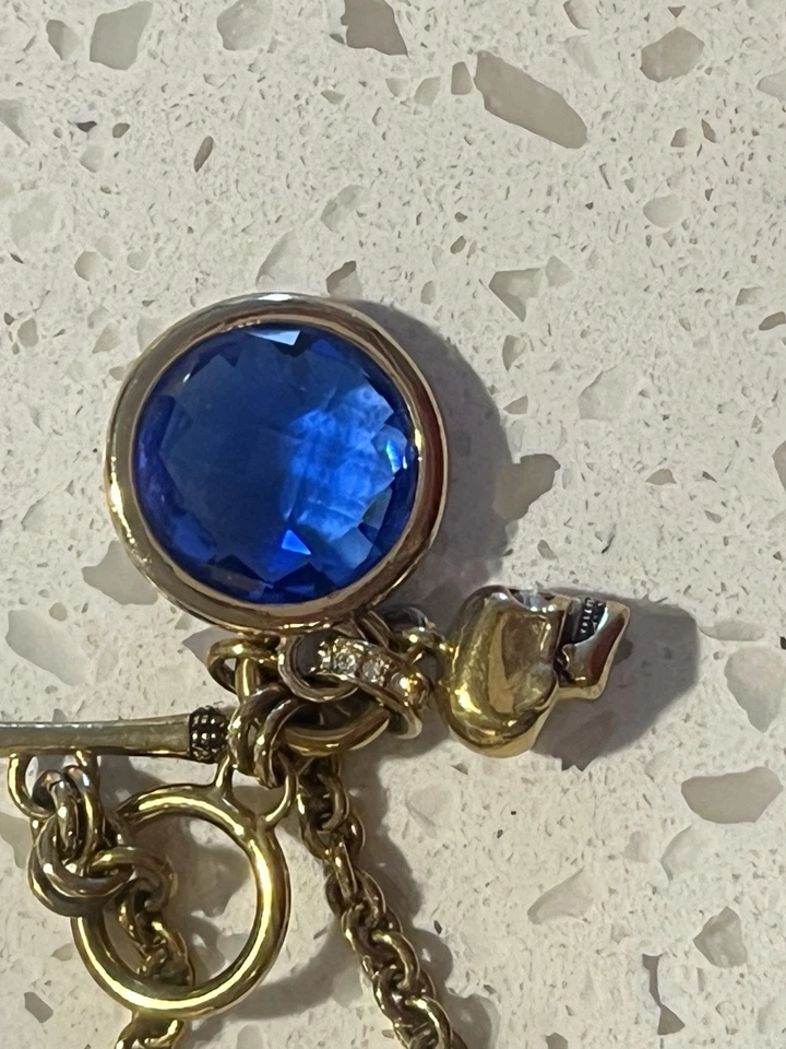 Juicy Couture Goldtone Skull Charm Bracelet With Faux Blue Stone Costume Jewelry - Image 3 of 4