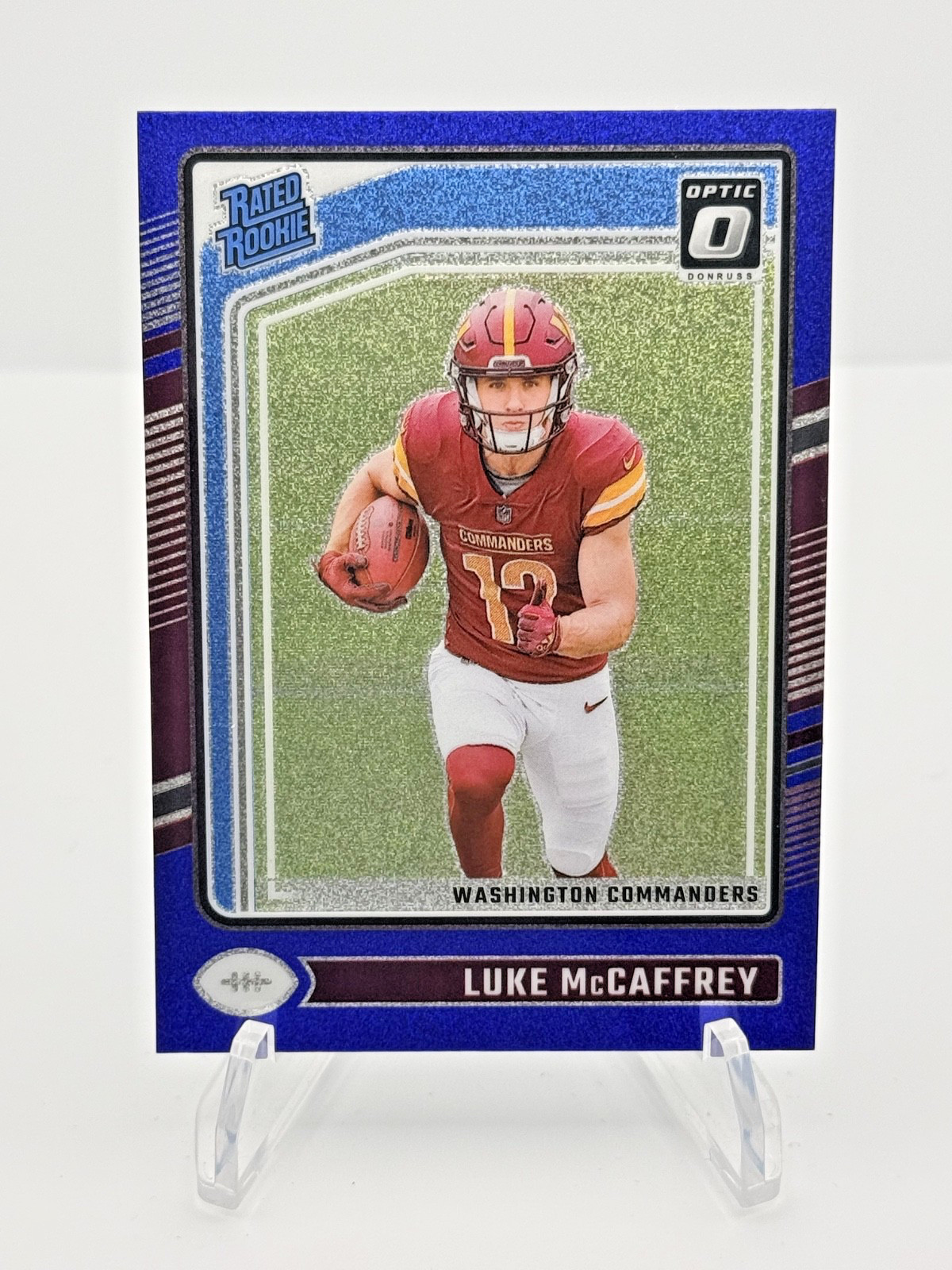 2024 Donruss Optic - Rated Rookie Luke McCaffrey Blue Glitter Prizm RC SSP #268