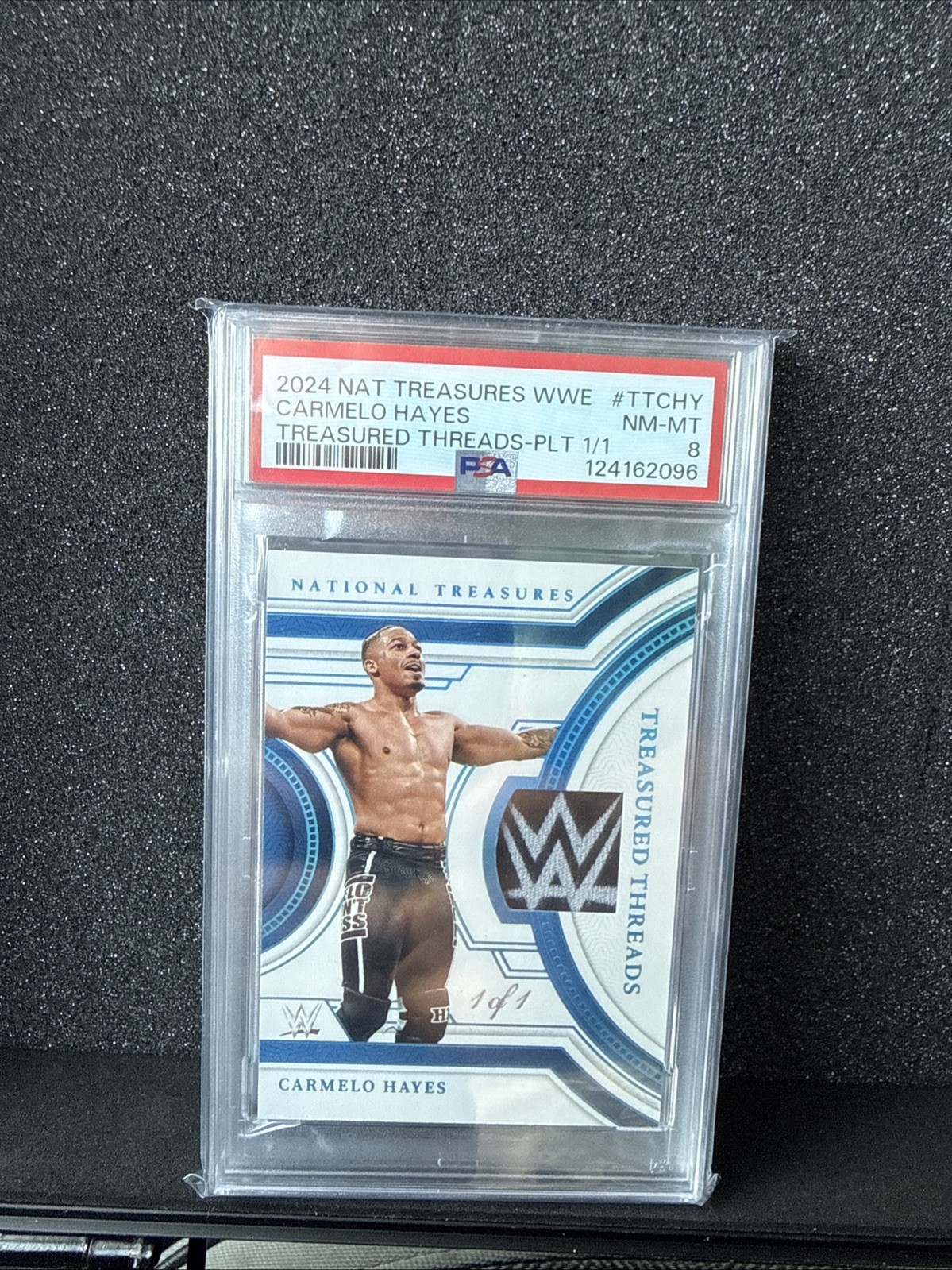 2024 Panini National Treasures WWE Treasured Threads Carmelo Hayes 1/1 PSA 8