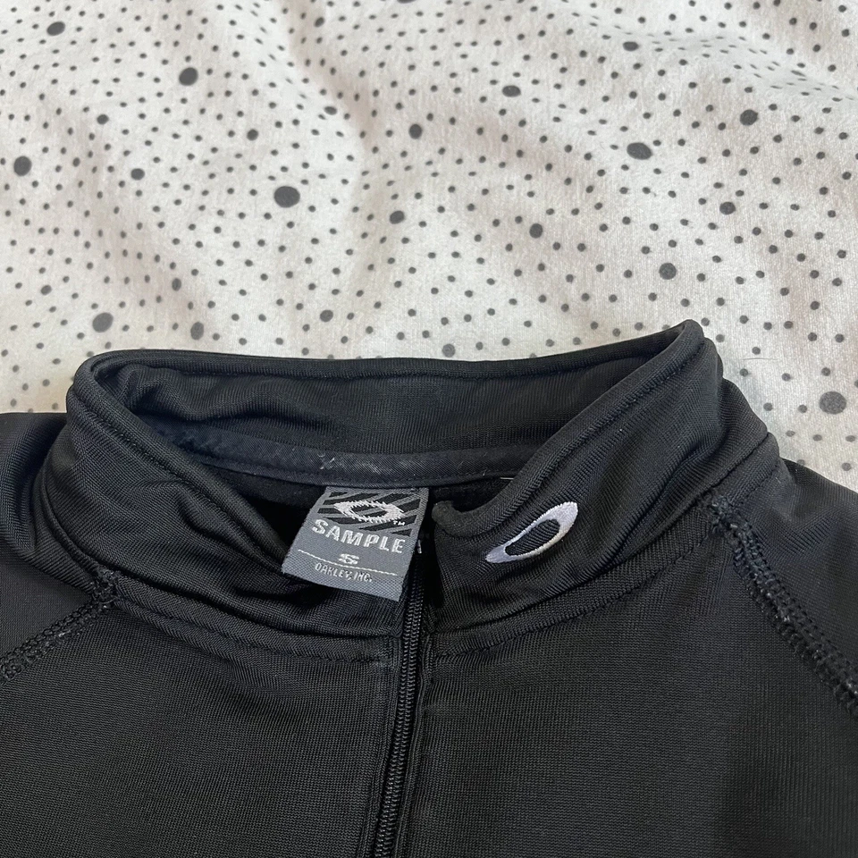 MUESTRA Chaqueta Oakley Cuarto Cremallera Para Mujer S Negra Golf Tenis Ropa de Calle Preppy Foto 2 de 4
