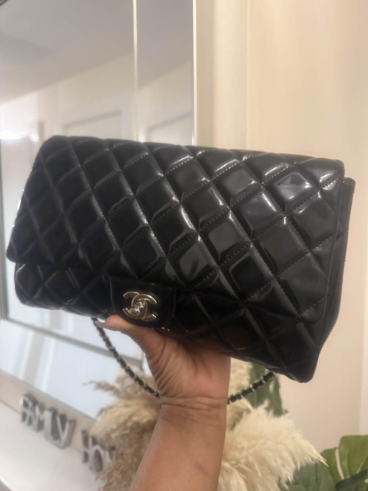 Chanel Classic Flap iconic diamond signature silver-tone bag CC turn-lock.