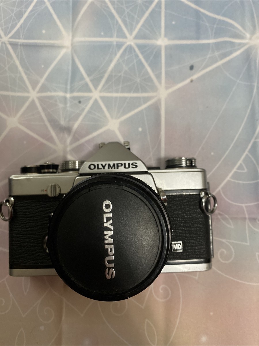 Olympus OM-1 Md camera w/ sigma zoom F=100 200mm lens and Tucky