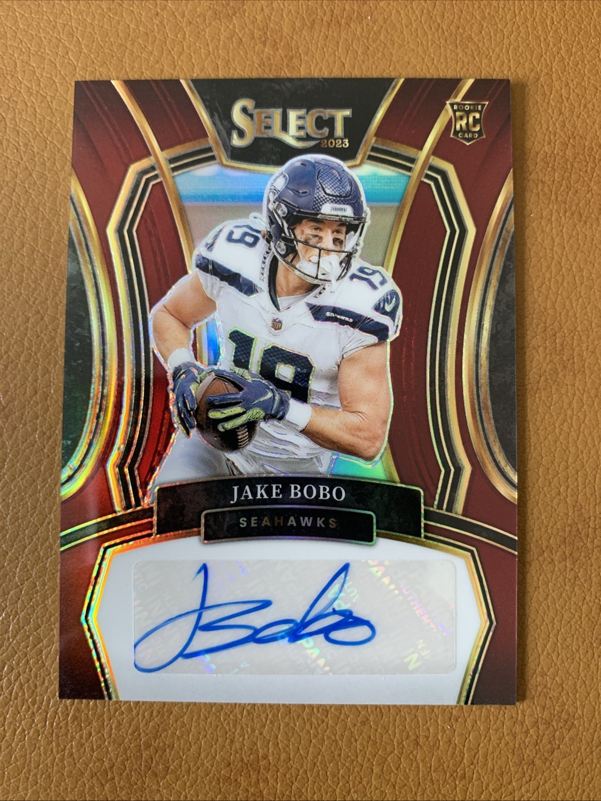 2023 Panini Select Football Seahawks Jake Bobo Rookie Auto Maroon Prizm # /75 RC