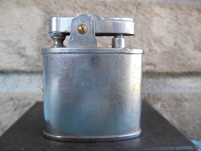 modern cigarette lighter VINTAGE MODERN HMC OVAL ETCHED CHROME AUTOMATIC CIGARETTE LIGHTER. WORKS!