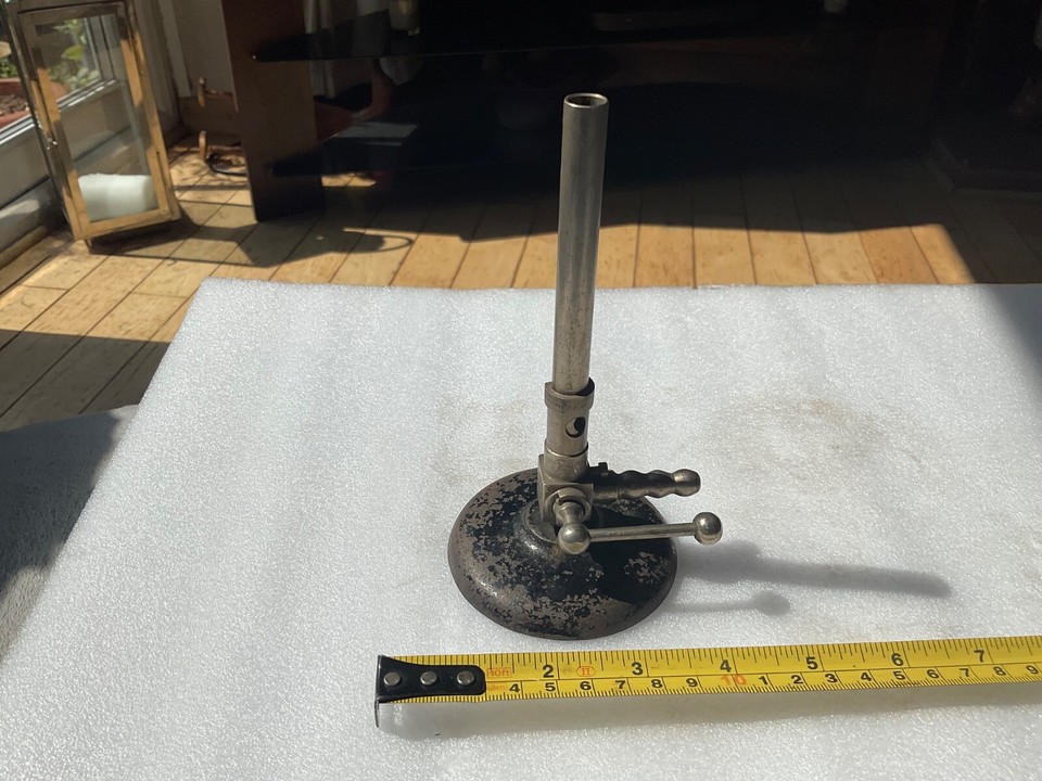 A genuine antique Bunsen burner — the iconic symbol of mad-scientist curiosity, beautiful as a steampunk desk piece or lab-themed display.