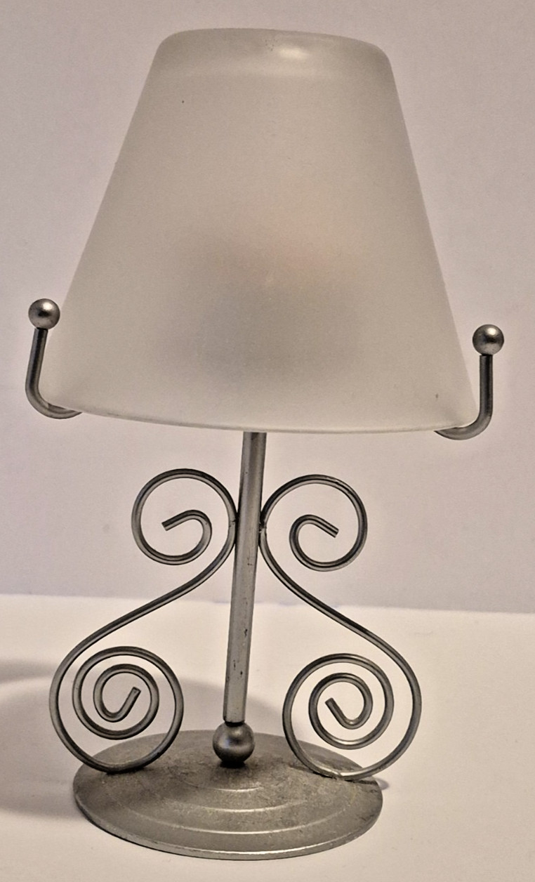 Has Scroll Work With Shade And Candle