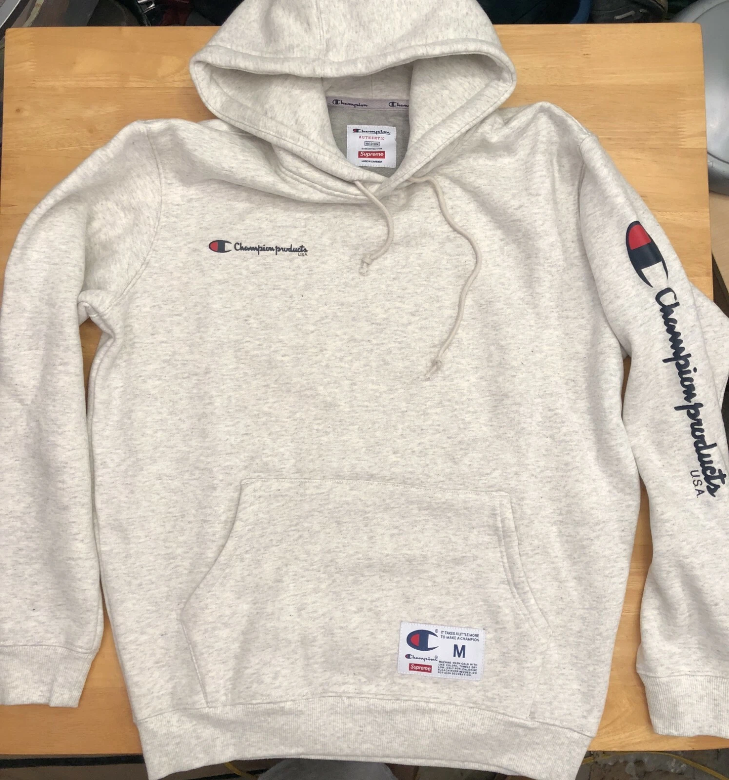 Sweat à capuche logo Champion & Supreme gris taille M moyenne   expédié le jour même