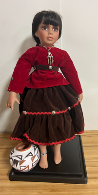 Native American  Porcelain Doll - in sitting postion with stand