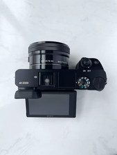 Sony Alpha a6000 24.3MP Mirrorless Digital Camera w/ 16-50mm OSS Lens English