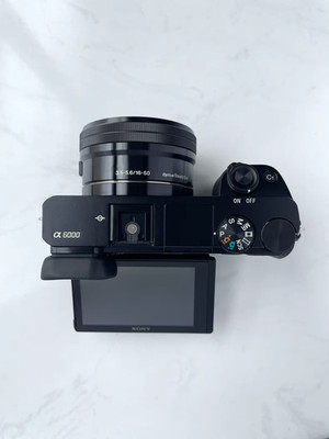 Sony Alpha a6000 24.3MP Mirrorless Digital Camera w/ 16-50mm OSS Lens English