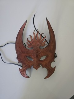 Handcrafted leather mask with large curved horns
