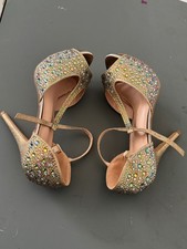 glamorous women  s high-heeled sandals in a metallic