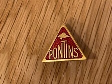 Pontins Holiday Camp enamel badge. RED TRIANGLE PONTINS LOGO