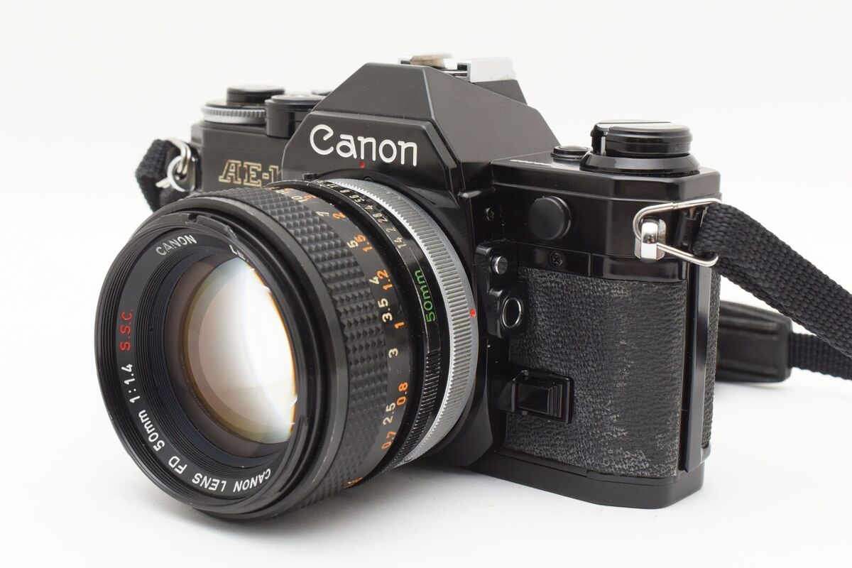 Canon AE-1 Black 35mm Film Camera FD 50mm f/1.4 S.S.C. Lens Canon AE-1 Black 35mm Film Camera FD 50mm f/1.4 S.S.C. Lens