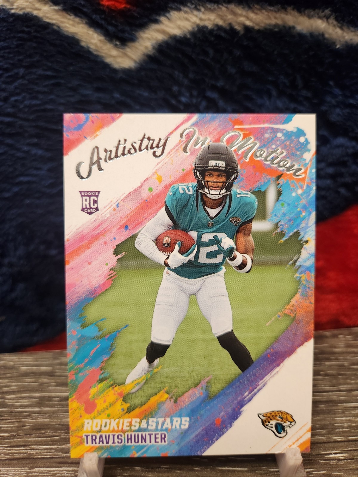 2025 Panini Rookies And Stars - Artistry In Motion Travis Hunter #8 (RC)