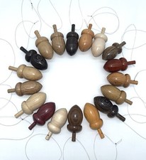 10 hand turned mini acorn baubles/decorations in native and tropical hardwoods.