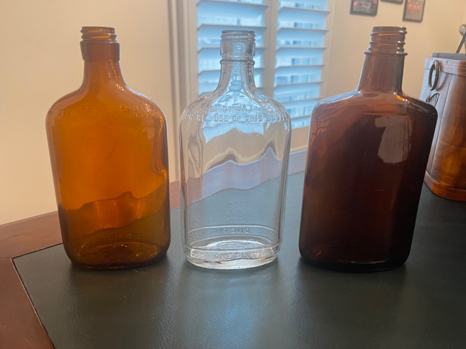 3 Vintage ( 2 Amber 1 Clear) One Pint Glass Whisky Bottles All have been tumbled-image