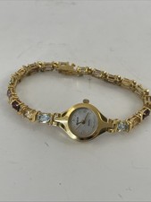 Reloj para mujer Jasco Geneve esfera de 18 mm con esfera mop banda de piedras preciosas tono dorado 7,25"