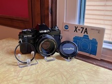 Minolta X-7A 35mm Film SLR Camera in Black with MD Rokkor-X 50mm 1.7 Lens  Cap