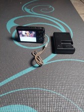 Sony Cyber-shot DSC-W180 10.1 MP digital camera, black, with charger.