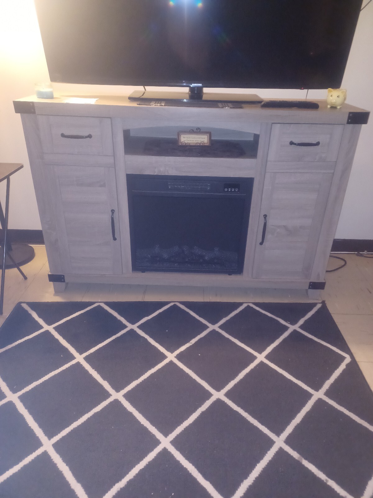 With A Fire Place. It's A Blonde Oak Wood..
