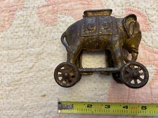 Antique AC Williams Cast iron elephant on wheels bank