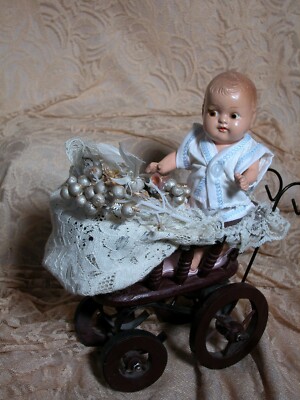 Composition baby doll 7'' in  wood Lace trimmed Carriage 8'' high 9'' long