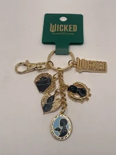 Universal Studios Wicked For Good Logo Charms Ensemble Keychain Dorthy Tin Man