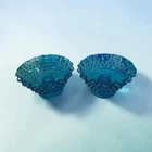 vintage Fenton glass candle holders in a blue hobnail pattern with ruffled edges