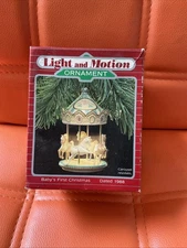 Vintage 1988 Hallmark Baby's First Christmas Light and Motion Ornament Carousel