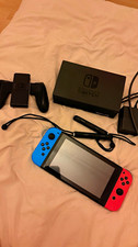 Nintendo Switch Konsole schwarz mit Dock, Joy-Con blau/rot, Grip, Netzteil
