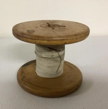 Vintage/Antique Wooden Spool With White Material Over Copper Wire