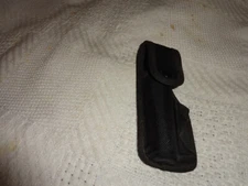 black synthetic flash light holder, snap shut holder only not the flash light