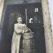 Beautiful Baby girl Happy with butter churn RPPC Real photo postcard 