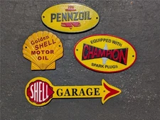 LOT OF 4 CAST IRON GAS & OIL SIGNS SHELL PENNZOIL CHAMPION GARAGE ARROW SIGN