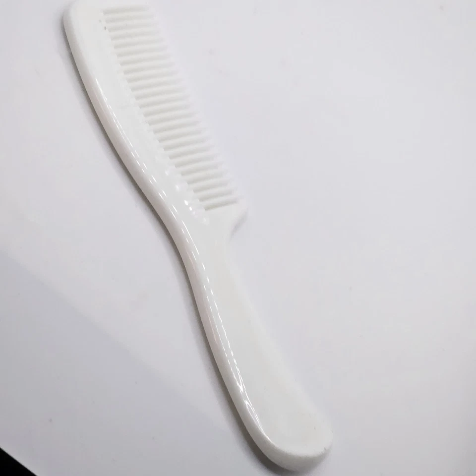 Peine desenredante de dientes anchos vintage de plástico duro blanco Clinique 7" Foto 2 de 3