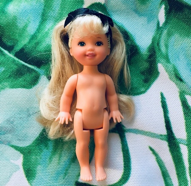 black barbie doll with blonde hair