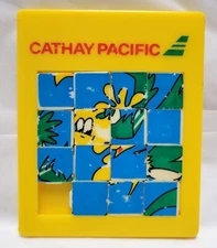 Vintage Cathay Pacific Yellow Sliding Puzzle Cartoon Graphic Collectible Toy