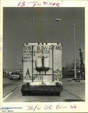 1988 Press Photo Message on the back of slow-moving truck driving along Bullard