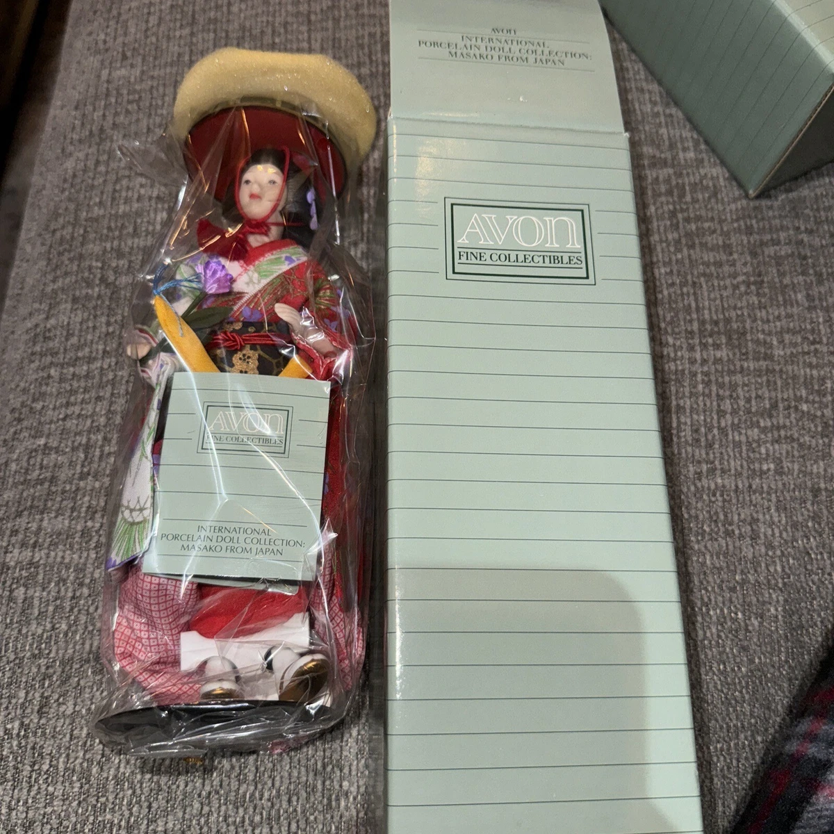 Avon international 2025 porcelain doll collection