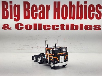 1/64 New DCP Black, Yel/Org/Red Graphics 352 Peterbilt 86'' Bunk Cabover Tractor