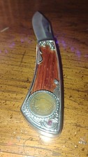vintage knife  with a vintage 1905 coin embedded into knife 