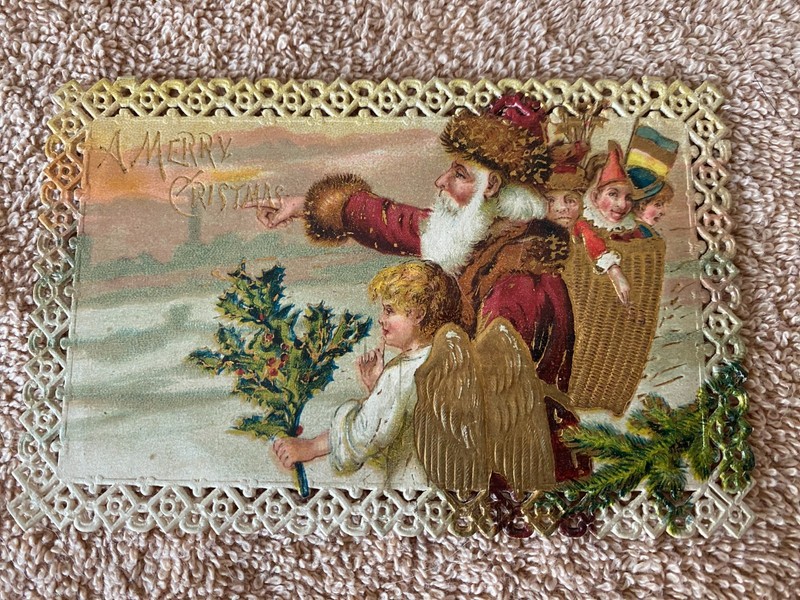 Antique Christmas Postcard. Early 1900s Embossed Picture with a Lace border